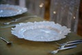 Sitting arrangement at a formal event or fine dining restaurant, set on a golden bronze elegant table ready for guests Royalty Free Stock Photo