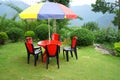 Sitting Arrangement wih Chair and Table at the top view point of Mountain Village Lungchok with Green Grass