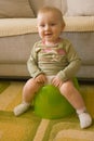 Sitting baby on potty Royalty Free Stock Photo