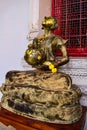 Sitting buddha sculpture begging for alms