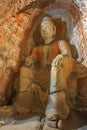 Sitting Buddha statue in cave 6 of the Yungang Grottoes Royalty Free Stock Photo