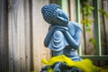 Black and white stone statue of sitting buddha in the garden Royalty Free Stock Photo