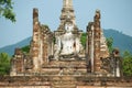 Sitting Buddha statue at the ruins of the main chapel of the Wat Mahathat temple in Sukhotai Historical Park, Thailand. Royalty Free Stock Photo