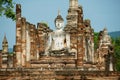 Sitting Buddha statue at the ruins of the main chapel of the Wat Mahathat temple in Sukhothai Historical Park, Thailand. Royalty Free Stock Photo