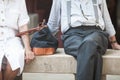 Sitting elderly couple on bench