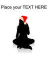 Sitting female wearing christmas hat