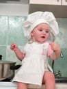 Sitting girl on kitchen