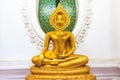 Sitting Golden Buddha statue in Thai Buddhist Temple Royalty Free Stock Photo