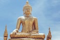 Sitting golden Buddha statue in Thailand over sky Royalty Free Stock Photo