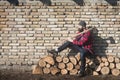 Sitting lumberjack woodcutter with axe