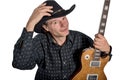 Sitting man with guitar and cowboy hat Royalty Free Stock Photo