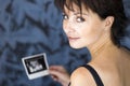 Sitting mother with ultra-sound photography