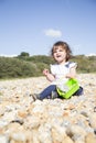 Sitting on a pebble beach