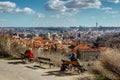 Sitting people enjoying view of Prague,Czech Republic. Prague panorama.Beautiful sightseeing on sunny spring day.Amazing European