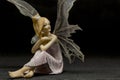 Sitting red hair fairy figurine