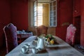 Sitting room in an abandoned castle, with the table still set Royalty Free Stock Photo