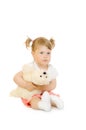 Sitting small girl with toy bear Royalty Free Stock Photo