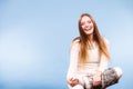 Sitting smiling woman wearing furry shoes Royalty Free Stock Photo