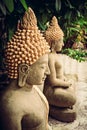 Sitting stone Buddha statues at temple area