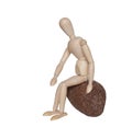 Sitting on stone wooden dummy