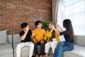 Sitting together on the couch laughing together Royalty Free Stock Photo