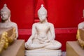 Sitting white Buddha statue mistake in create at temple Thailand