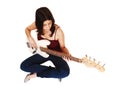 Sitting woman playing guitar. Royalty Free Stock Photo