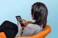 sitting woman using tablet. touching mobile device surface