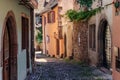 RIQUEWIHR, FRANCE - JULY 17, 2017: Picturesque street with traditional colorful houses in Riquewihr village on alsatian wine route Royalty Free Stock Photo