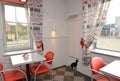 Situation in modern cafe with red chairs. Interior