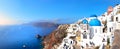 Sityscape of Oia village in Santorini island in summer morning, panoramic view Royalty Free Stock Photo