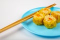 Siu Mai - Chinese steamed pork dumplings on blue plate Royalty Free Stock Photo