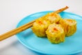 Siu Mai - Chinese steamed pork dumplings on blue plate Royalty Free Stock Photo