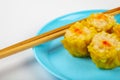 Siu Mai - Chinese steamed pork dumplings on blue plate Royalty Free Stock Photo