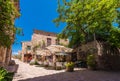 SIURANA DE PRADES, SPAIN - JUNE 26, 2017: View of buildings and cafes in the village. Copy space for text.