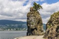 Siwash Rock Stanley Park Seawall in sunny day with white clouds over North Vancouver British Columbia Canada Royalty Free Stock Photo