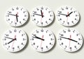 Six analog clocks on wall, showing world time Royalty Free Stock Photo