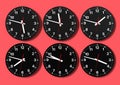 Six analog clocks on wall, showing world time