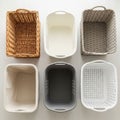 A white plastic basket with handles and smooth sides and a gray Royalty Free Stock Photo