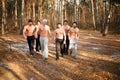 Six beefy men walking in a an autumn Royalty Free Stock Photo
