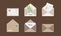 Six beige envelopes on brown background