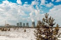 Six biton tubes of a nuclear power plant against a cloudy blue sky Royalty Free Stock Photo