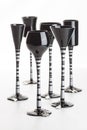Six black coloured champagne glasses