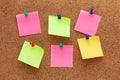 Six blank sticky notes pinned on a cork board Royalty Free Stock Photo