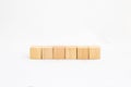 Six blank wooden blocks in a row on a white background with blank space for your text, letters or numbers Royalty Free Stock Photo