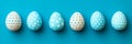 Six Blue And Beige Easter Eggs In A Row On A Blue Background With White Polka Dot Patterns Royalty Free Stock Photo