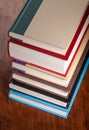 Six books stacked neatly on a table Royalty Free Stock Photo