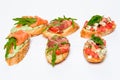 Six bruschettes with greens, cheese, meat and fish