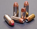 Six bullets, three 40 caliber hollow point and three 44spl Royalty Free Stock Photo