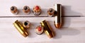 Six 40 caliber hollow point bullets along with three 44 special red tipped bullets shot from above